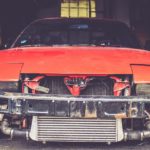 orange car that needs repair