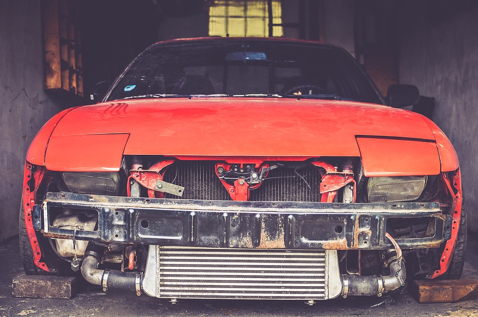 orange car that needs repair