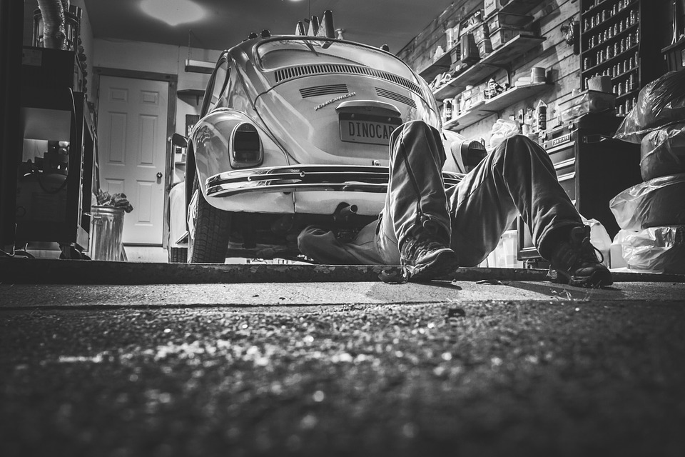 man repairing a beetle